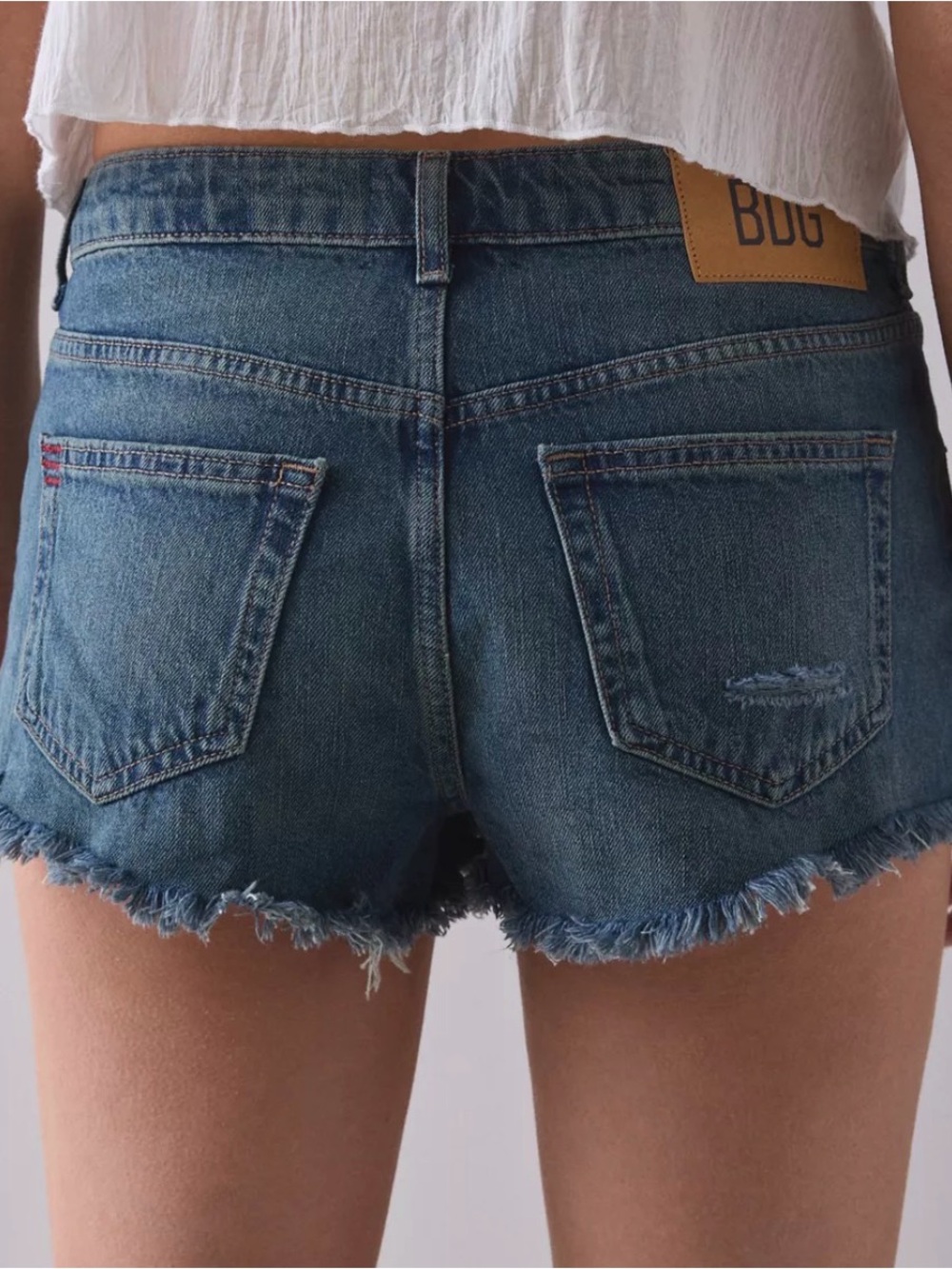 BDG Frayed Hem Low-Rise Boyfriend Denim Shorts in Medium Blue